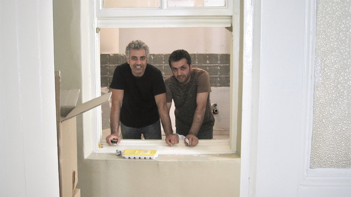 Istanbul Place Apartments team smile during kitchen renovation project